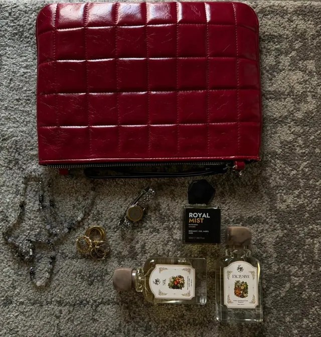 Frag bottles beside a red bag